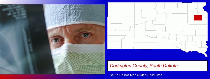 a physician viewing x-ray results; Codington County, South Dakota highlighted in red on a map