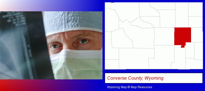 a physician viewing x-ray results; Converse County, Wyoming highlighted in red on a map