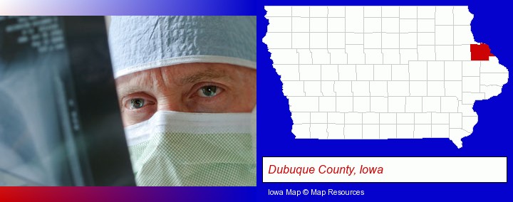 a physician viewing x-ray results; Dubuque County, Iowa highlighted in red on a map