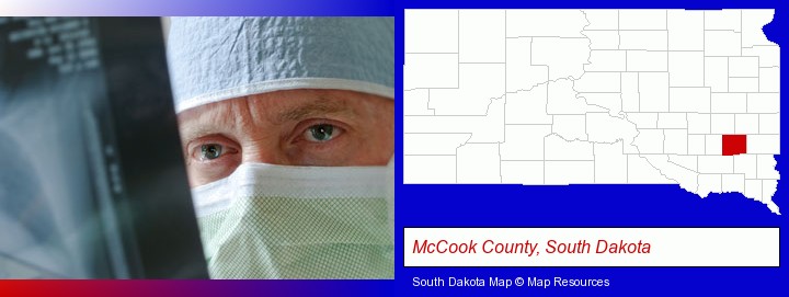a physician viewing x-ray results; McCook County, South Dakota highlighted in red on a map