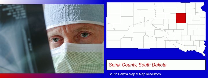 a physician viewing x-ray results; Spink County, South Dakota highlighted in red on a map
