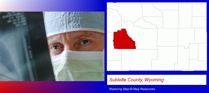 a physician viewing x-ray results; Sublette County, Wyoming highlighted in red on a map