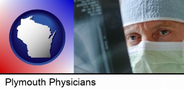 a physician viewing x-ray results in Plymouth, WI