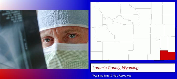 a physician viewing x-ray results; Laramie County, Wyoming highlighted in red on a map